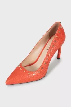 Leather shoes decorated with spikes