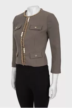 Jacket decorated with chain and beads