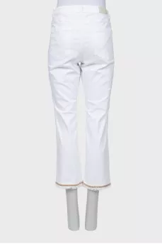 White jeans with hem decoration