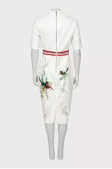 White dress with a pattern on the hem