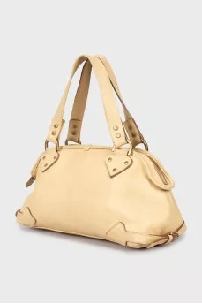 Beige bag with gold hardware