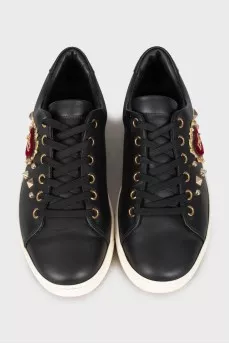 Black leather sneakers with decor