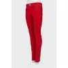 Red jeans with embellished waist
