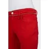 Red jeans with embellished waist