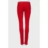 Red jeans with embellished waist