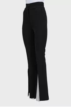 Flared trousers with slits at the bottom