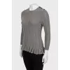 Knitted jumper with ruffled bottom