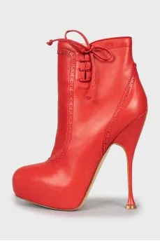 Red ankle boots with perforations