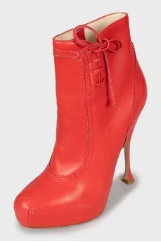 Red ankle boots with perforations