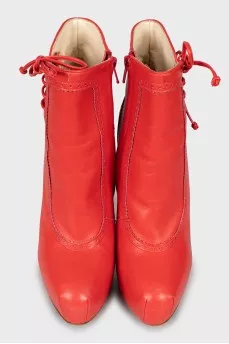 Red ankle boots with perforations