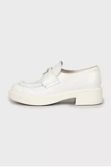 White leather loafers