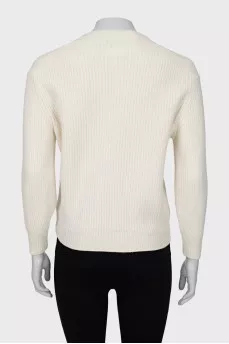 Knitted sweater decorated with sequins