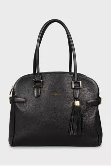 Leather bag decorated with buckles
