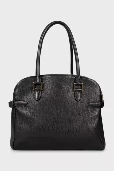 Leather bag decorated with buckles