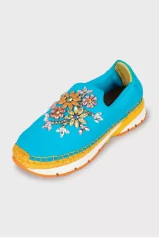 Sneakers decorated with rhinestones