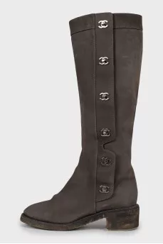 Suede boots with metal logos