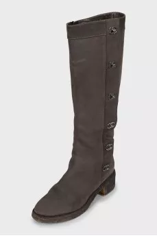 Suede boots with metal logos