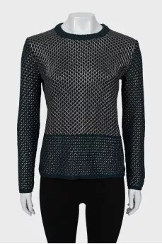 Knitted sweater decorated with weaving