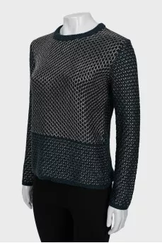 Knitted sweater decorated with weaving