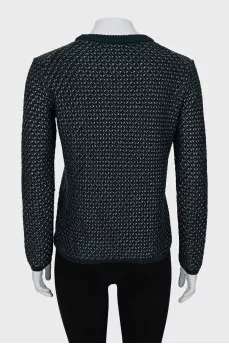 Knitted sweater decorated with weaving