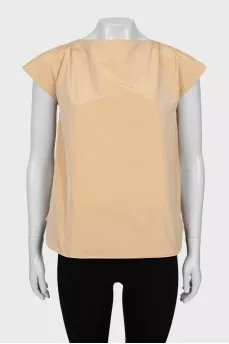 Beige blouse with ties on the back
