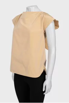 Beige blouse with ties on the back