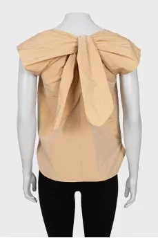 Beige blouse with ties on the back
