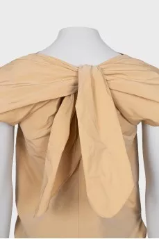 Beige blouse with ties on the back