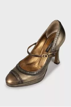 Gold perforated shoes