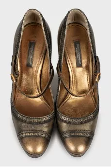 Gold perforated shoes