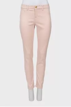 Light pink jeans with gold button