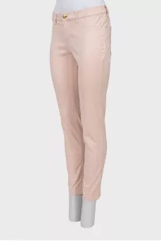 Light pink jeans with gold button