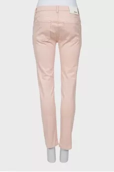 Light pink jeans with gold button