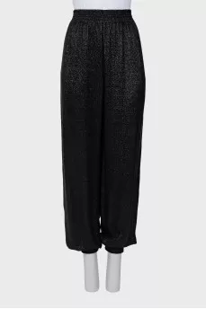 Elastic trousers with lurex