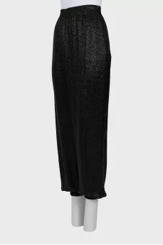 Elastic trousers with lurex