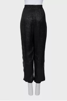 Elastic trousers with lurex
