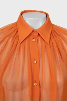 Translucent orange blouse