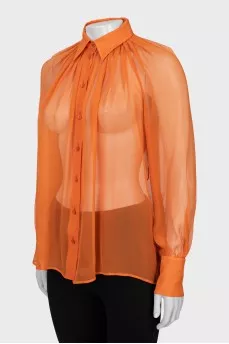 Translucent orange blouse