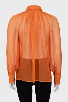 Translucent orange blouse