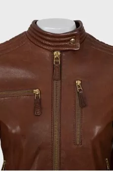 Leather jacket with metal logo on the back