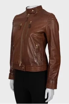 Leather jacket with metal logo on the back