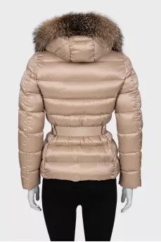 Beige down jacket with fur on the hood