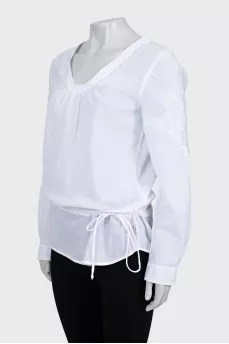 White blouse decorated with embroidery