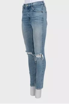 High-waisted jeans with ripped effect