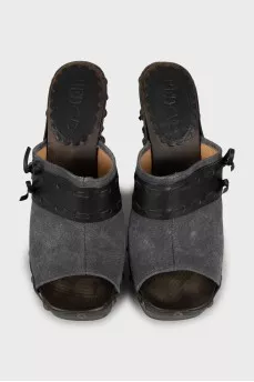 Clogs with leather inserts and metal rivets