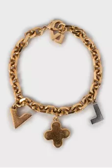 Gold bracelet with charms