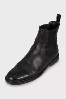 Black leather boots with perforations