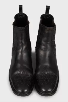 Black leather boots with perforations