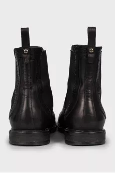 Black leather boots with perforations
