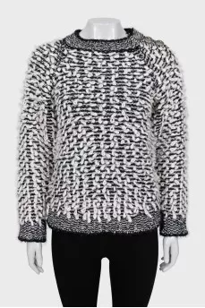 Knitted sweater decorated with buttons
